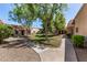 Beautiful community courtyard with walking path, grass and mature trees at 17228 N 16Th Dr # 3, Phoenix, AZ 85023