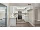 Modern kitchen featuring white cabinets, updated appliances, and a bright skylight at 17228 N 16Th Dr # 3, Phoenix, AZ 85023
