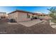 Large backyard featuring a brick-paved patio, with manicured landscaping, offering a serene and private outdoor space at 1783 W Cool Water Way, San Tan Valley, AZ 85144