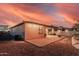 Expansive backyard showcasing a covered patio, brick-paved area, and low-maintenance landscaping, perfect for outdoor living and entertainment at 1783 W Cool Water Way, San Tan Valley, AZ 85144