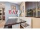 Inviting dining area with a built-in banquette, wooden table and modern decor at 1783 W Cool Water Way, San Tan Valley, AZ 85144