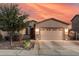 Charming single-Gathering home featuring a two-car garage, desert landscaping and neutral-toned exterior paint at 1783 W Cool Water Way, San Tan Valley, AZ 85144