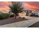 Two story home features a two-car garage, spacious driveway, and low maintenance landscaping at 1783 W Cool Water Way, San Tan Valley, AZ 85144