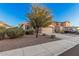 Two story home features a two-car garage, spacious driveway, and low maintenance landscaping at 1783 W Cool Water Way, San Tan Valley, AZ 85144