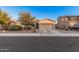 Well-maintained home with a two-car garage, desert landscaping, and mature trees at 1783 W Cool Water Way, San Tan Valley, AZ 85144