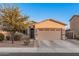 Single story home features a two-car garage, side yard with fencing, and desert landscaping at 1783 W Cool Water Way, San Tan Valley, AZ 85144