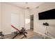Home gym featuring various equipment, natural light, and plenty of space for effective workouts at 1783 W Cool Water Way, San Tan Valley, AZ 85144