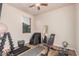 Home gym featuring various equipment, natural light, and plenty of space for effective workouts at 1783 W Cool Water Way, San Tan Valley, AZ 85144