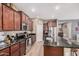 A spacious kitchen with stainless steel appliances and granite countertops is well-lit with recess lighting at 1783 W Cool Water Way, San Tan Valley, AZ 85144