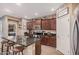 Modern kitchen with granite countertops, stainless steel appliances, and a center island with seating at 1783 W Cool Water Way, San Tan Valley, AZ 85144