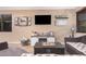 Comfortable living room with a modern fireplace and television at 1783 W Cool Water Way, San Tan Valley, AZ 85144