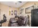 Cozy Personal Cave featuring dual reclining leather chairs and a TV, offering a relaxing space for entertainment at 1783 W Cool Water Way, San Tan Valley, AZ 85144