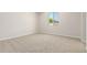 Cozy bedroom with plush carpeting and natural light from a window at 18340 W Patrick Ln, Surprise, AZ 85387