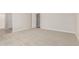 Spacious bedroom with plush carpeting, and ensuite bathroom at 18340 W Patrick Ln, Surprise, AZ 85387