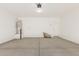 A spacious two-car garage with ample room for vehicles and storage at 18340 W Patrick Ln, Surprise, AZ 85387