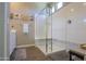 Bright bathroom featuring seamless glass-enclosed shower and neutral color palette at 19969 N Santa Cruz Dr, Maricopa, AZ 85138