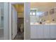Bathroom featuring double sinks, large mirror, and a separate toilet room for added privacy at 19969 N Santa Cruz Dr, Maricopa, AZ 85138