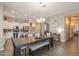 Dining area featuring an island with breakfast bar, modern lighting and views of the kitchen at 19969 N Santa Cruz Dr, Maricopa, AZ 85138