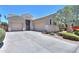 Single-Gathering home with well-maintained landscaping, dual-car garage, and concrete driveway at 19969 N Santa Cruz Dr, Maricopa, AZ 85138