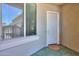 A welcoming front door and window view with tile flooring create an inviting entrance at 19969 N Santa Cruz Dr, Maricopa, AZ 85138