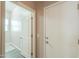 Hallway view of the laundry room and garage access at 19969 N Santa Cruz Dr, Maricopa, AZ 85138