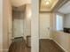 Hallway with dark wood floors and white doors at 19969 N Santa Cruz Dr, Maricopa, AZ 85138