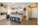 Bright kitchen featuring a center island with bar seating, modern appliances and ample storage space at 19969 N Santa Cruz Dr, Maricopa, AZ 85138