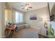 Cozy office space with soft carpet, a ceiling fan, a desk, and a comfortable sofa at 19969 N Santa Cruz Dr, Maricopa, AZ 85138