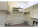 Bright walk-in closet with adjustable shelving, hanging rods, and convenient floor-level storage hampers at 19969 N Santa Cruz Dr, Maricopa, AZ 85138