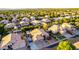 Expansive aerial view of a neighborhood featuring well-maintained homes and lush, mature landscaping at 2058 E Marlene Dr, Gilbert, AZ 85296