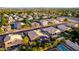 An aerial view of a quiet neighborhood showcases well-maintained homes and mature trees at 2058 E Marlene Dr, Gilbert, AZ 85296