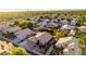 Overview of a desert community with single Gathering homes, mature trees, and blue skies at 2058 E Marlene Dr, Gilbert, AZ 85296