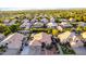 Stunning view of a desert community highlighting lush greenery, single Gathering homes and mountain views at 2058 E Marlene Dr, Gilbert, AZ 85296