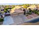 Charming single Gathering home with an extended driveway, three car garage, and desert landscaping at 2058 E Marlene Dr, Gilbert, AZ 85296