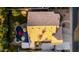 Aerial view of a backyard with a pool, jacuzzi, colorful umbrellas, and an expansive tile roof at 2058 E Marlene Dr, Gilbert, AZ 85296