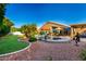 Expansive backyard featuring a well-manicured lawn, vibrant landscaping, and a luxurious pool with jacuzzi, perfect for entertainment at 2058 E Marlene Dr, Gilbert, AZ 85296