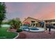 Stunning backyard with a pool, spa, ample seating, and lush landscaping for ultimate relaxation and entertainment at 2058 E Marlene Dr, Gilbert, AZ 85296