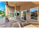 Spacious backyard featuring an extended patio, multiple windows, and ample space for outdoor enjoyment at 2058 E Marlene Dr, Gilbert, AZ 85296