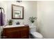 Cozy powder room with wood vanity, marble countertop, decorated with fresh cut lavender at 2058 E Marlene Dr, Gilbert, AZ 85296