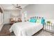 Comfortable bedroom featuring wood floors, ceiling fan, and access to private bath at 2058 E Marlene Dr, Gilbert, AZ 85296