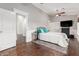 Bedroom with rich wood floors, ceiling fan and access to ensuite bath at 2058 E Marlene Dr, Gilbert, AZ 85296