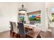 Bright dining room with views of the pool, featuring a modern chandelier and comfortable seating at 2058 E Marlene Dr, Gilbert, AZ 85296