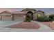 Inviting single-story home with a terracotta roof, arched entry, and low-maintenance desert landscaping at 2058 E Marlene Dr, Gilbert, AZ 85296