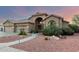 Inviting single-story home with a terracotta roof, arched entry, and low-maintenance desert landscaping at 2058 E Marlene Dr, Gilbert, AZ 85296
