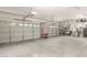 Spacious garage with two overhead doors and ample storage space, perfect for vehicles and projects at 2058 E Marlene Dr, Gilbert, AZ 85296