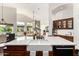 Bright kitchen with island sink, marble countertops, wooden cabinets, and open view to living area at 2058 E Marlene Dr, Gilbert, AZ 85296