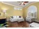 Cozy living room with hardwood floors, a large window, and a white sofa at 2058 E Marlene Dr, Gilbert, AZ 85296