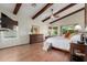 Spacious bedroom with wood floors, vaulted ceiling, exposed beams and lots of natural light at 2058 E Marlene Dr, Gilbert, AZ 85296