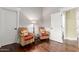 Comfortable sitting area with two chairs, a lamp, and hardwood floors at 2058 E Marlene Dr, Gilbert, AZ 85296