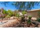 Low-maintenance backyard with gravel, potted plants, and desert landscaping providing a tranquil outdoor retreat at 2312 W Temple St, Chandler, AZ 85224